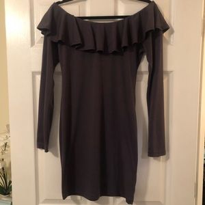 Knit tunic with ruffles on top. Size: Medium